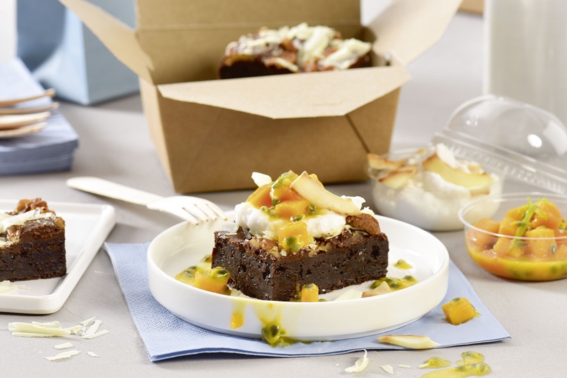 Pecan Brownie with coconut yoghurt and mango and passion fruit salad
